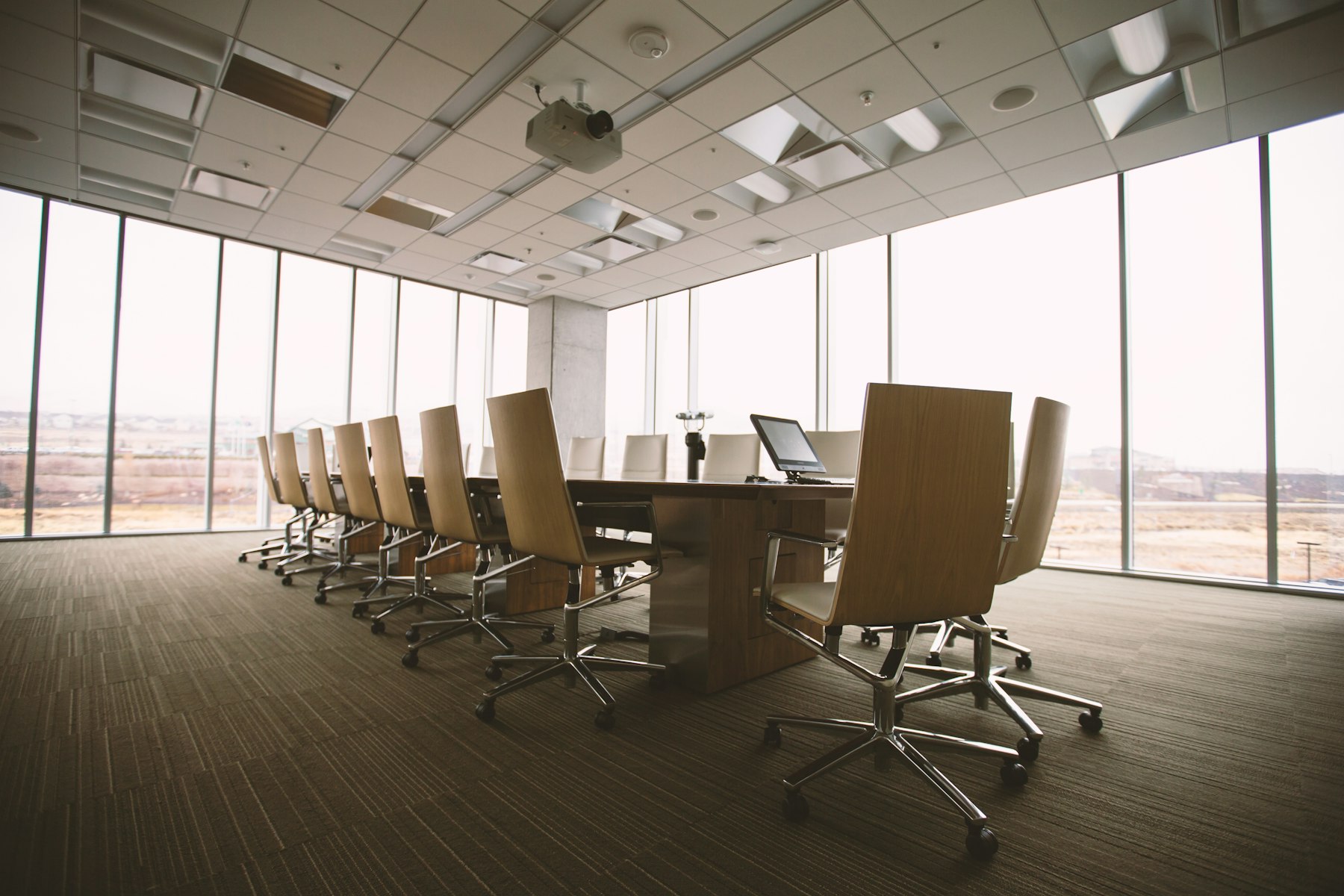 An empty conference table and chairs