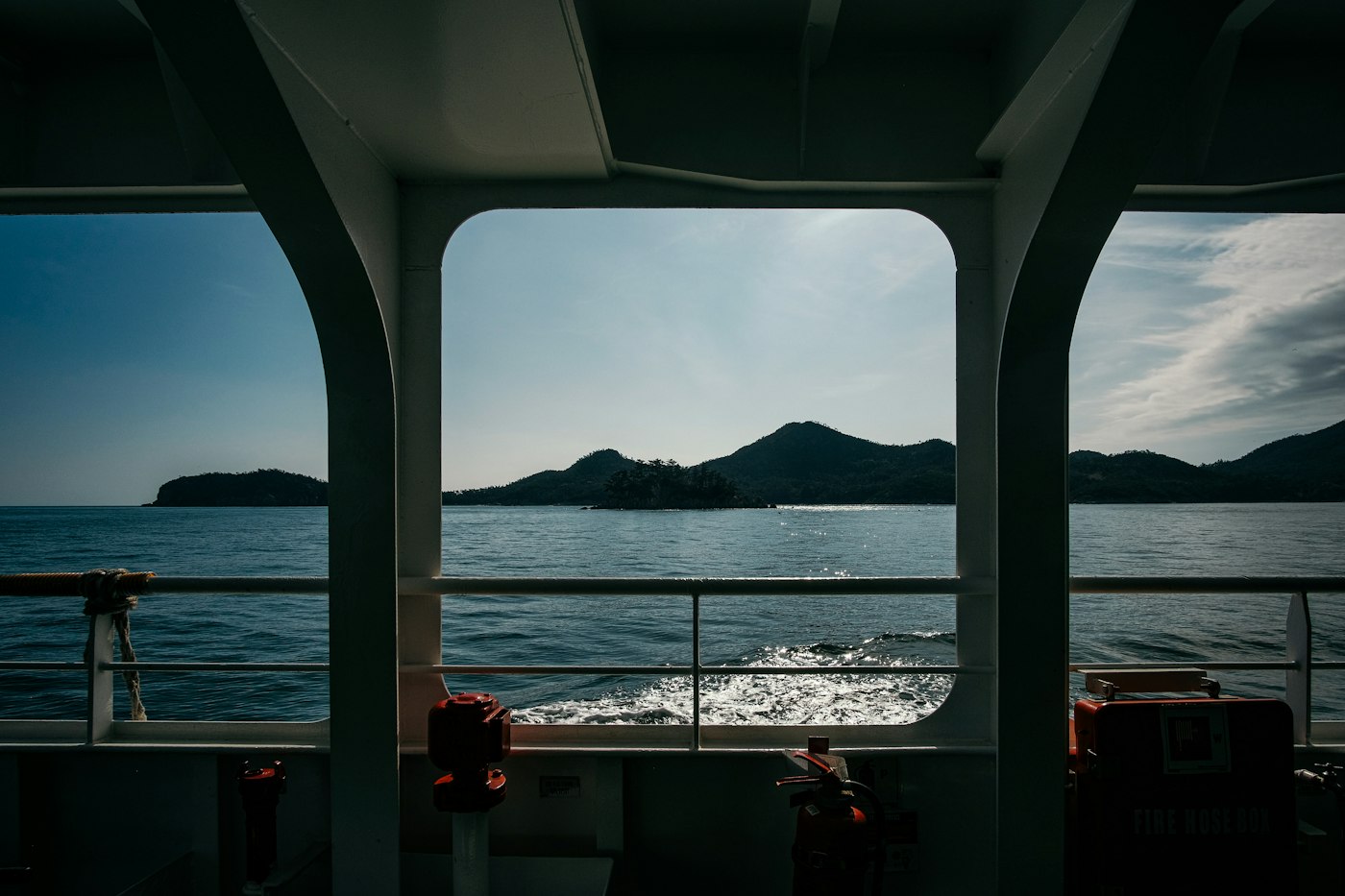 Open water seen from the deck of a boat